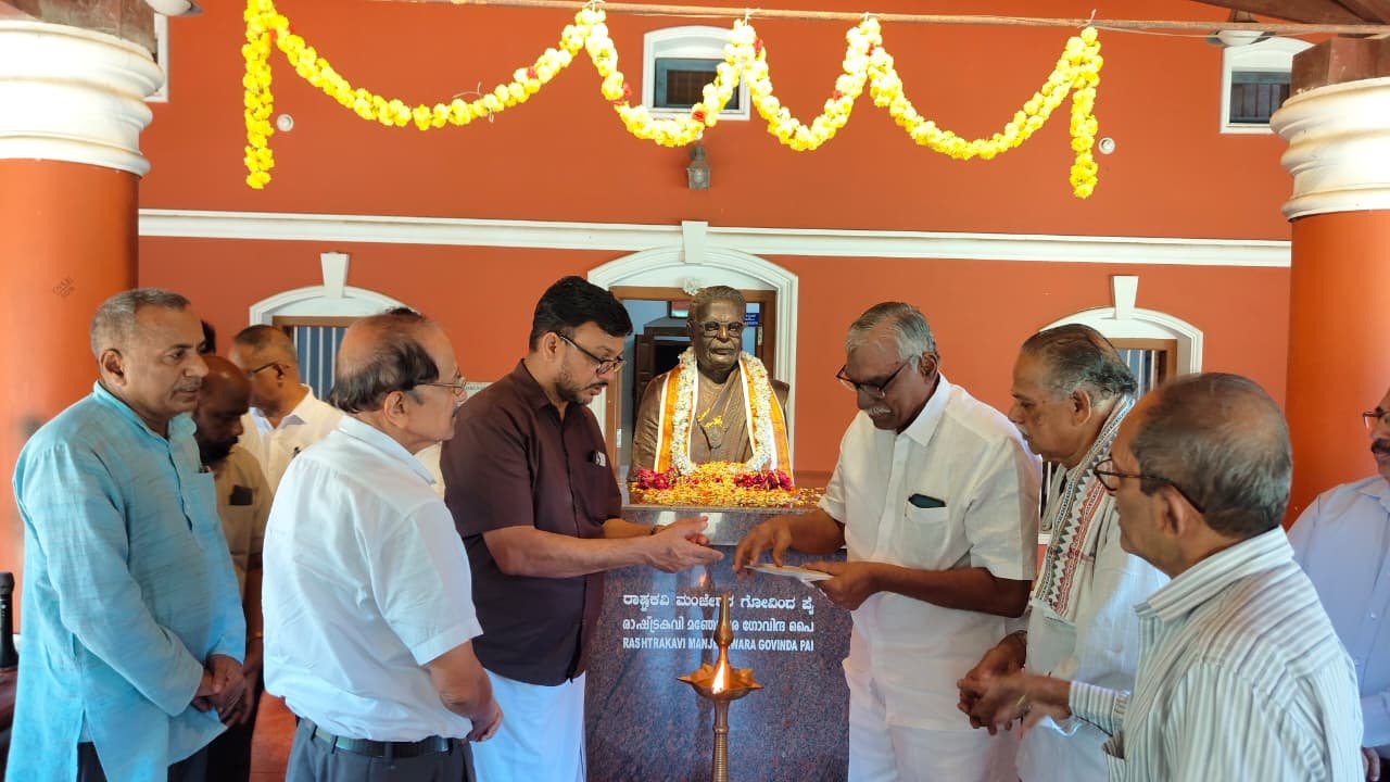 Trustees and guests lighting the ceremonial lamp