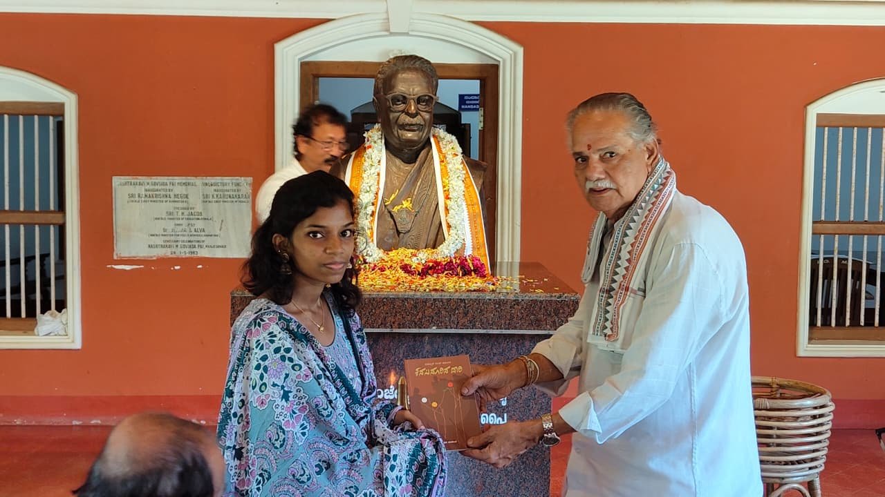 A student receiving a book during the commemoration