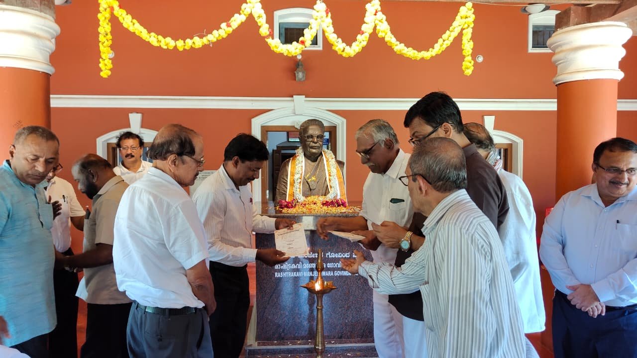 Guests gathered around the ceremonial lamp