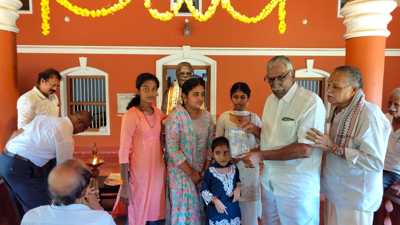 A family receiving a presentation during the programme