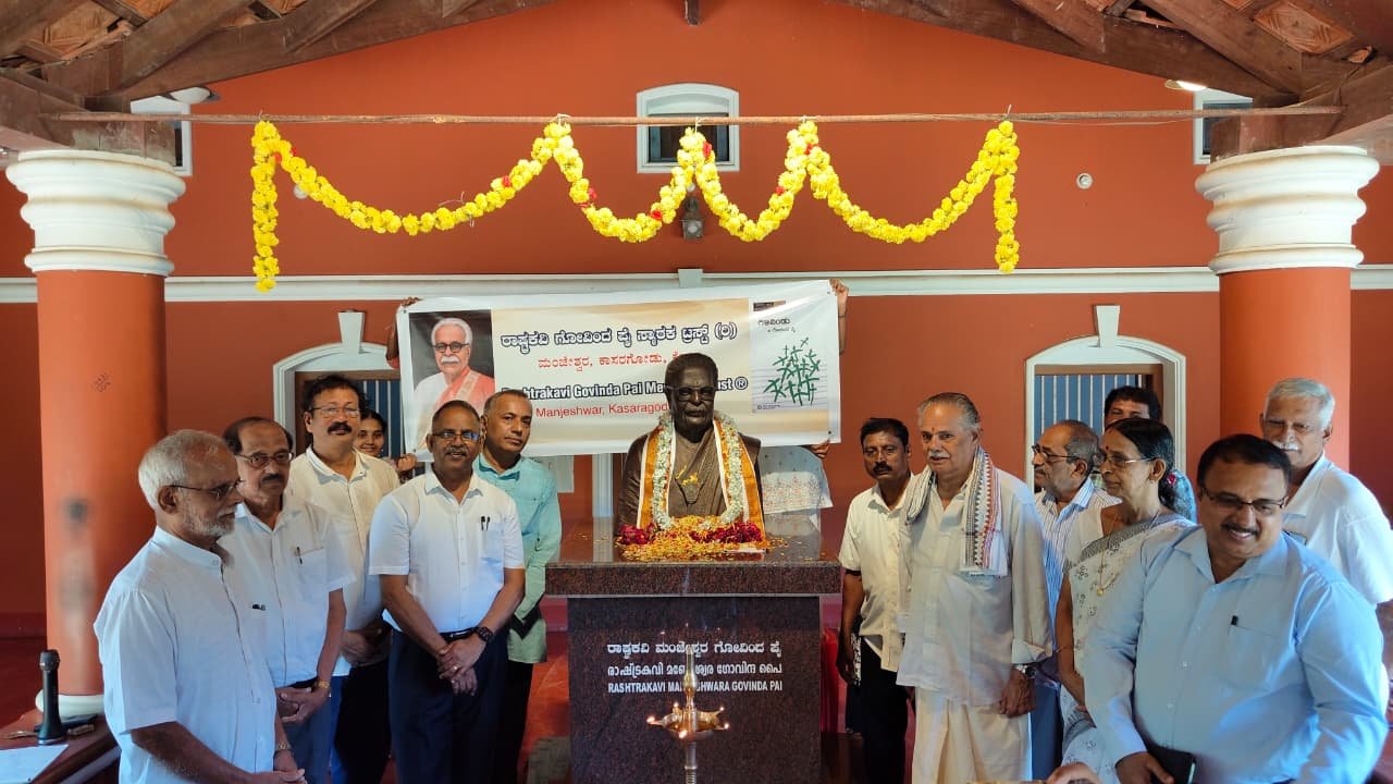 Trustees, guests, and participants gathered beside the poet's statue